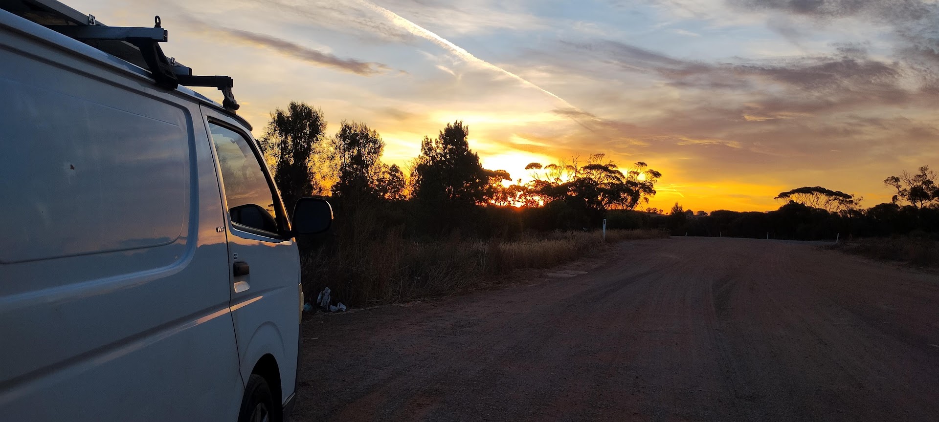 Trevor Lancaster's van on the road at sunset